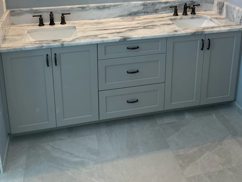 Gray double vanity with a Shadow Storm marble top, backsplash and two undermount sinks