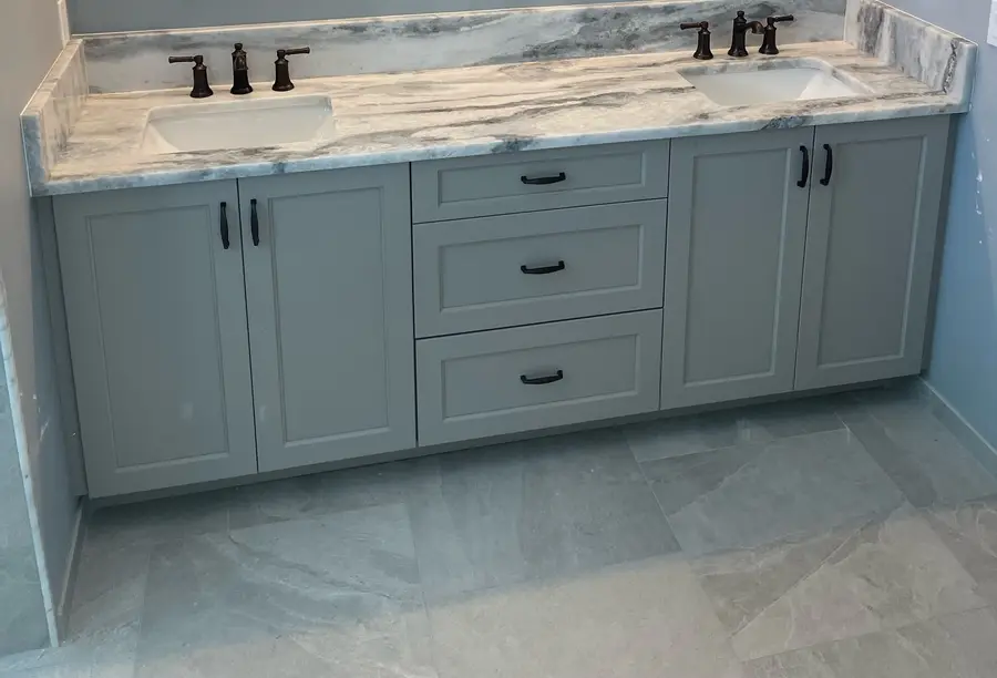 Gray double vanity with a Shadow Storm marble top, backsplash and two undermount sinks